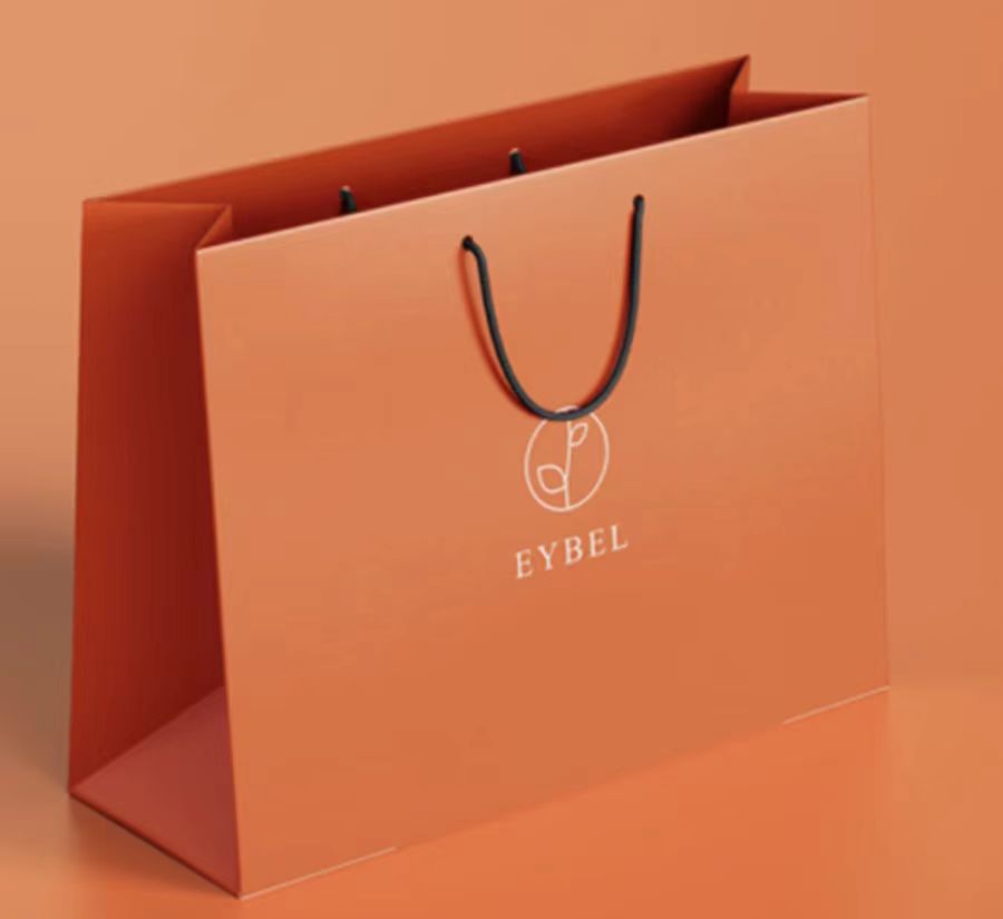 广州包装印刷手提袋厂家：服装手提纸袋的不同材质和用途（三）